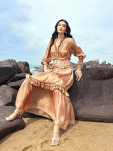 Pleated silk maxi dress with ruffle trim and shirred waist for graceful, full-length elegance